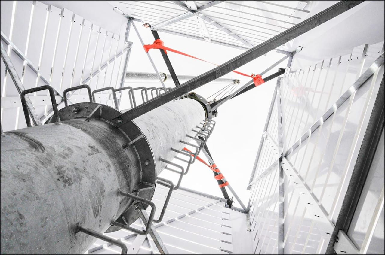 Mobile crane on an industrial site at dusk